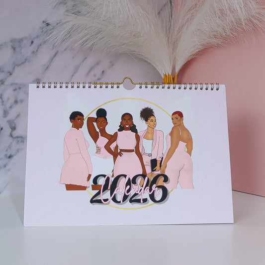 Calendar with illustration of five black women and '2026' text on a marble surface with decorative elements.